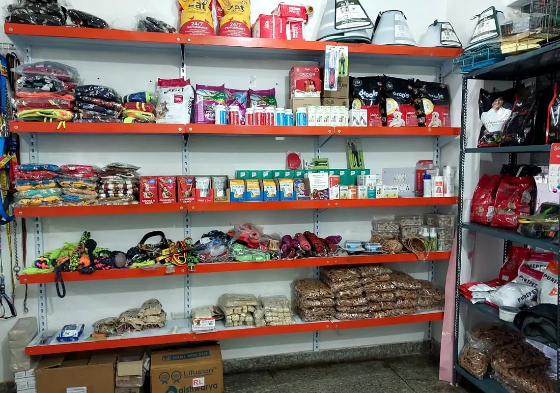 Shelves stocked with pet food, supplements, grooming tools and other veterinary supplies